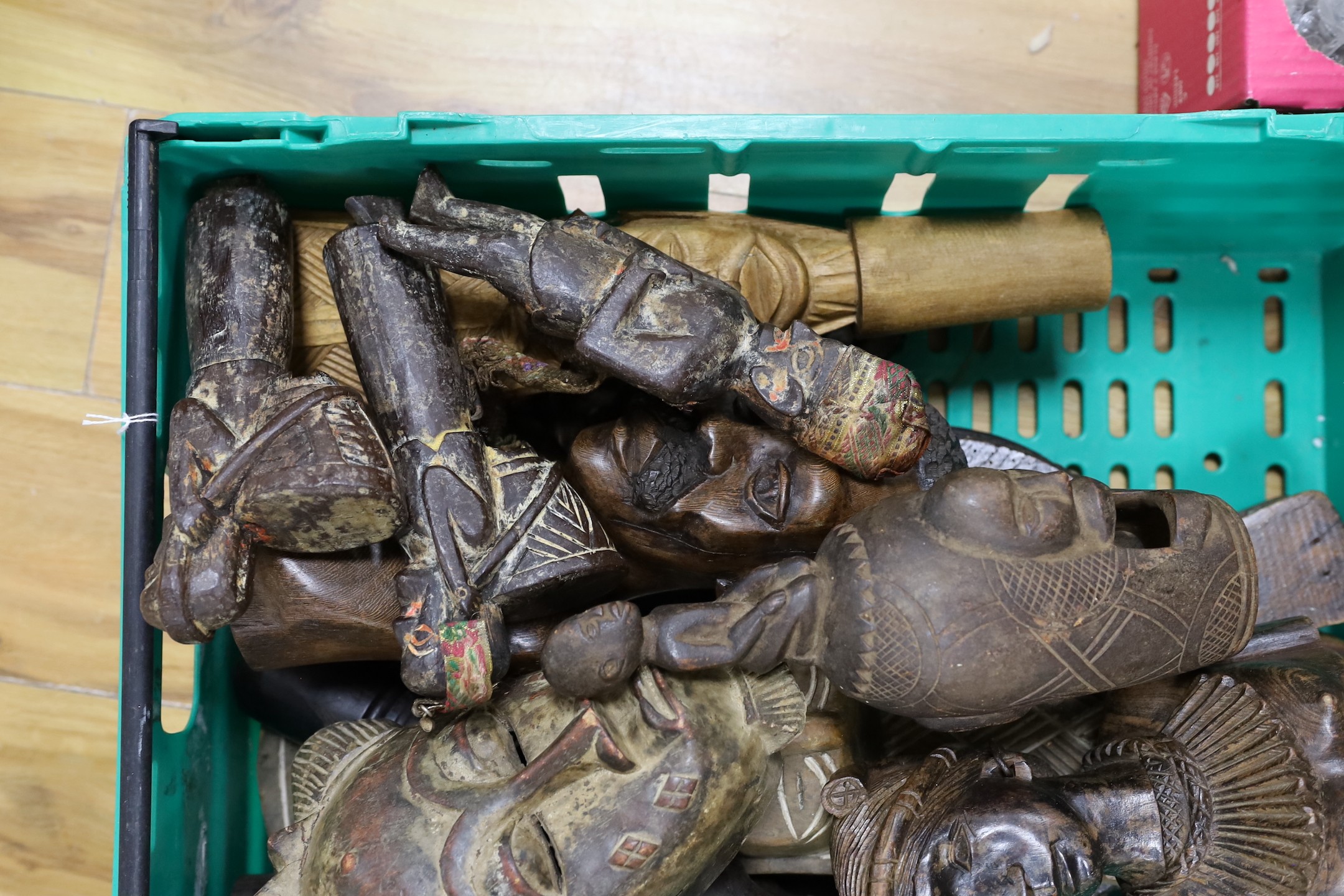 A group of African / Indian wood carvings, masks, etc.